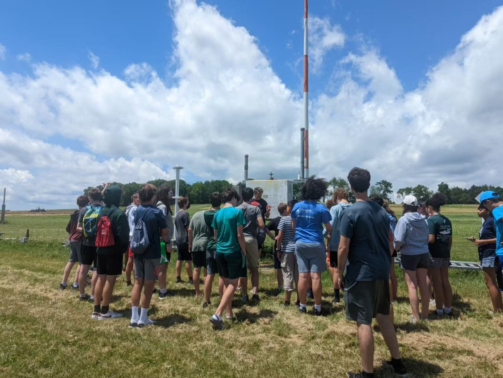 Weather camp field activity under a summer sky